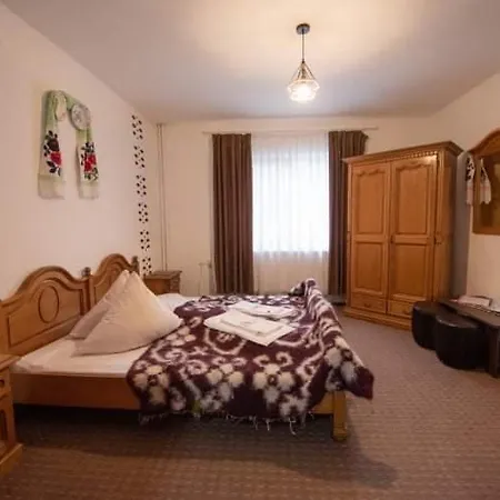 Gazde/Camere de închiriat Pensiunea Casa Mariuca